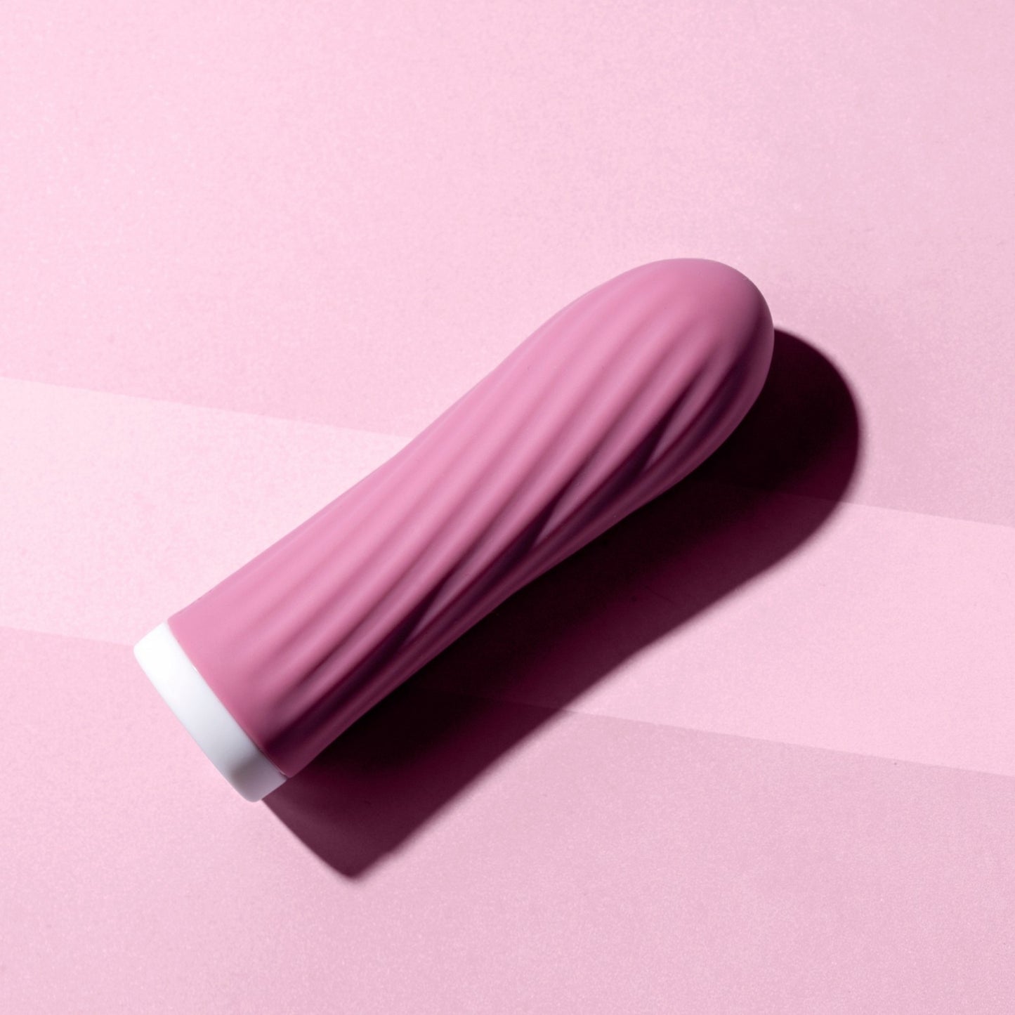Pink bullet vibrator on a pink background