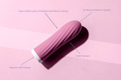 Compact pink bullet vibrator with labelled features: 10 modes, magnetic USB charging, water resistant, body-safe silicone.