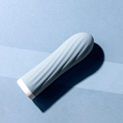 Blue bullet vibrator on a blue background