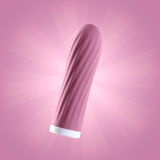 Pink bullet vibrator suspended in air against pink background