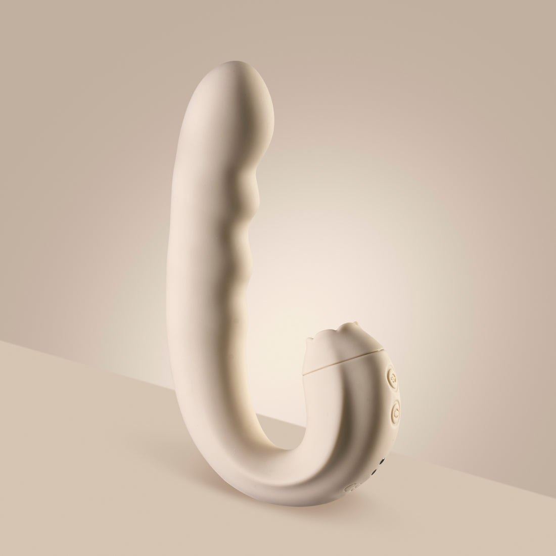 Vanilla clitoral licking vibrator standing upright on cream surface