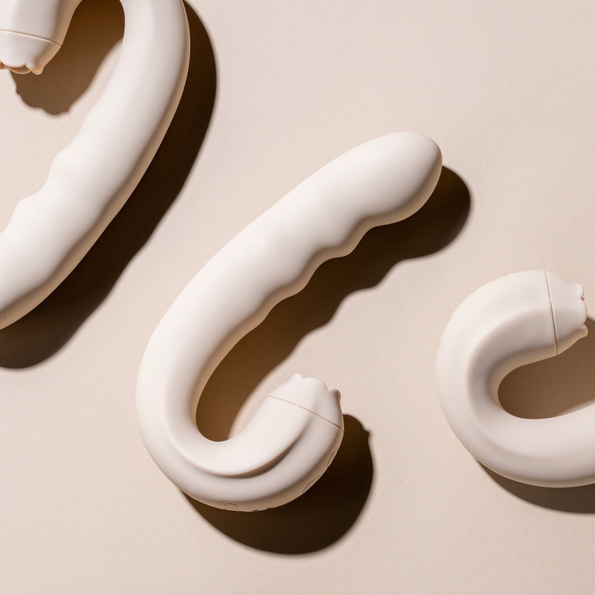 Licking vibrator on a beige background
