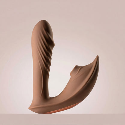 Brown clitoral suction vibrator on a beige background