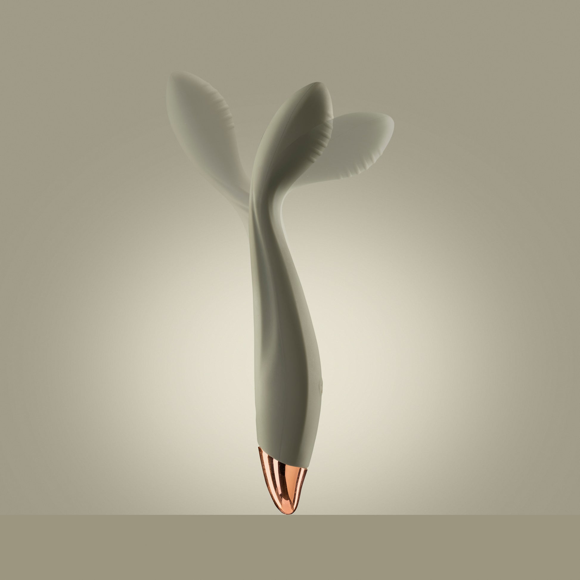 Green G-spot vibrator standing upright with visible motion in head, green background

