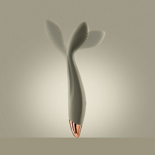 Green G-spot vibrator standing upright with visible motion in head, green background

