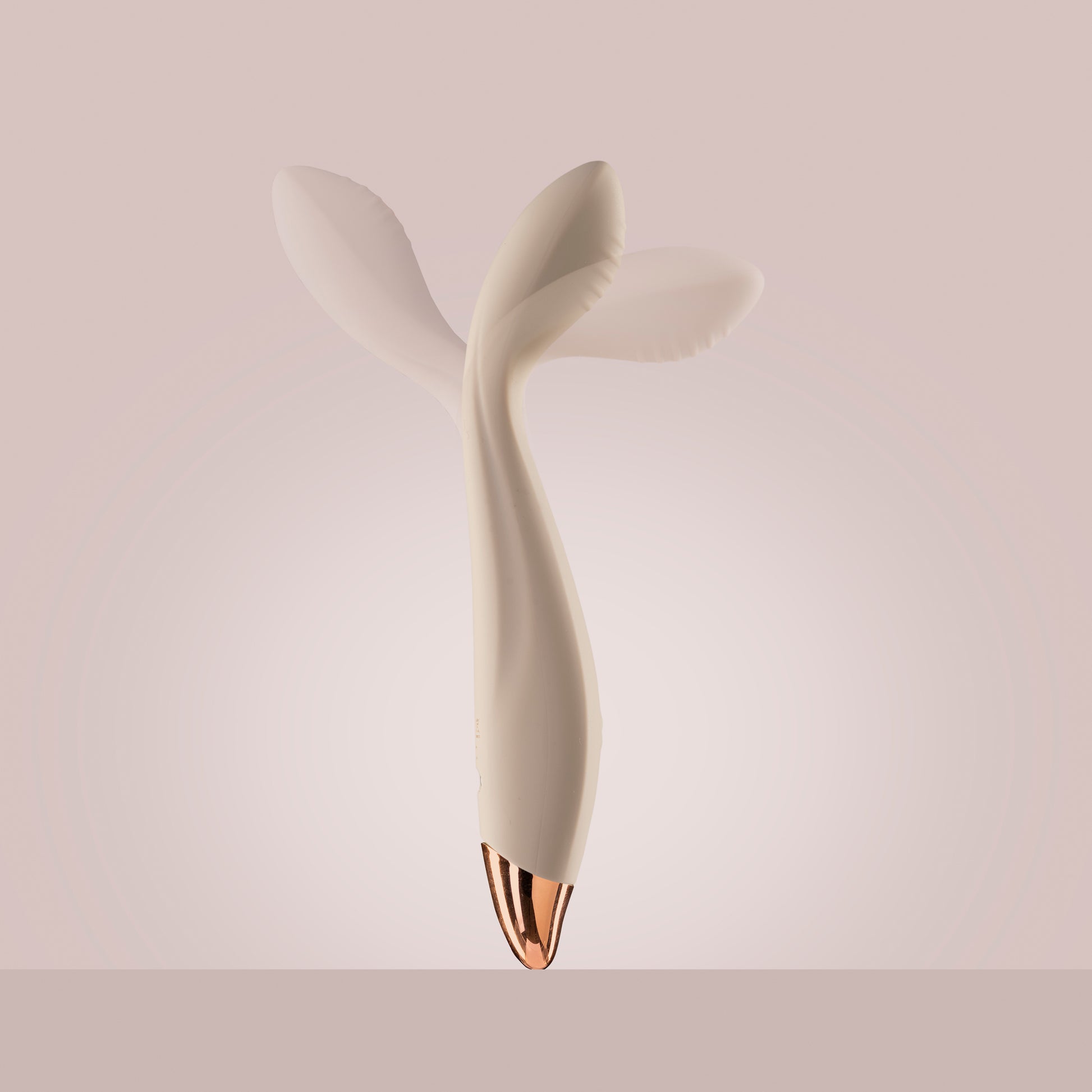 Vanilla G-spot vibrator standing up with vibrating head motion, pink background

