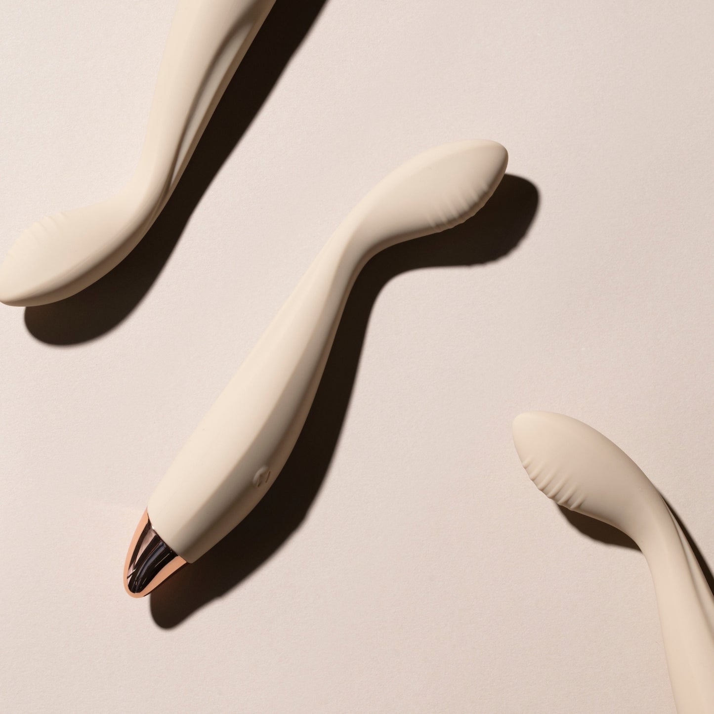 Vanilla G-spot vibrators on a beige background