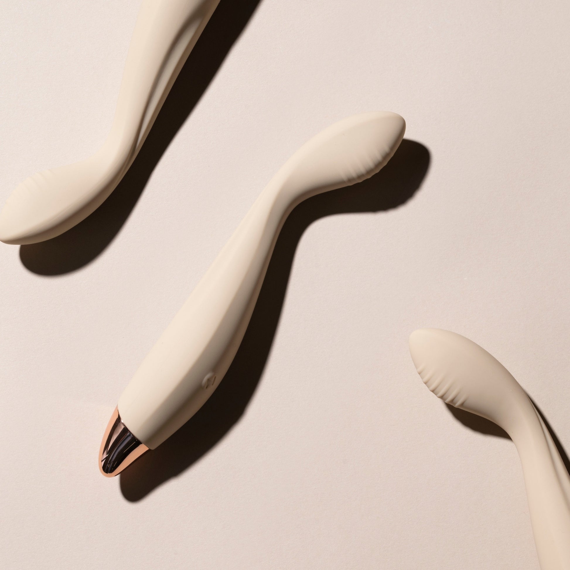 Vanilla G-spot vibrators on a beige background